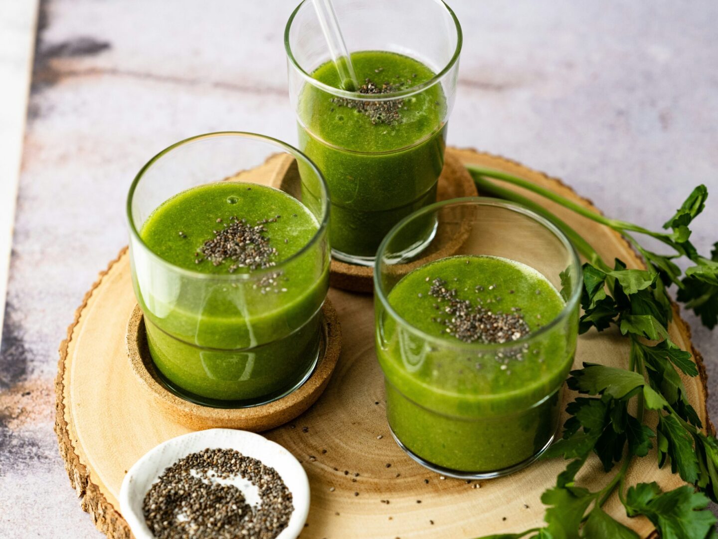 Wellness yacht charter green smoothie on tray with chia seeds