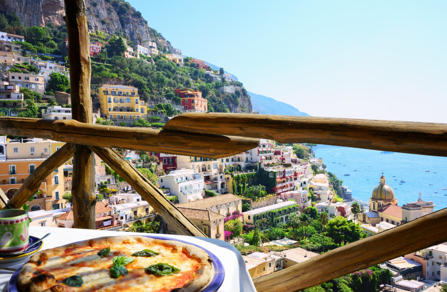 Pizza on Amalfi. Food atop cliff overlooking the sea. 